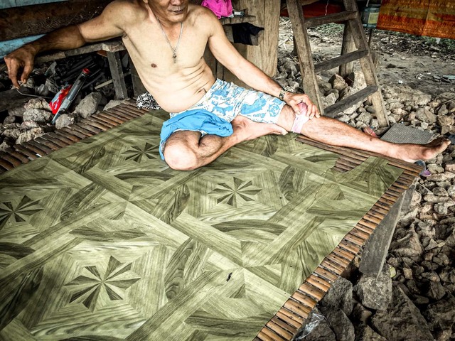 AT HOME. Dennis is nursing a boil on his knee that has disabled him for a week, making him unable to go to his carpentry work in Culion town proper. He's also one of the known pangolin hunters in Barangay Halsey.