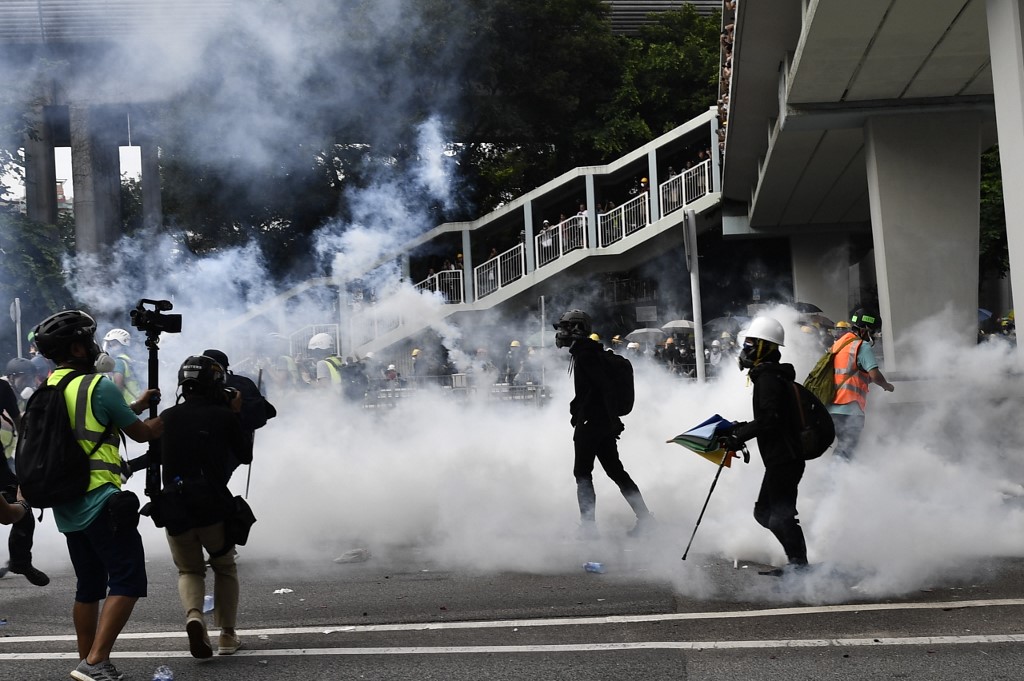 Police Fire Tear Gas Rubber Bullets At Hong Kongers Protesting Triad