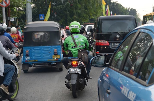 Mengapa ojek tradisional membenci Go  Jek  dan GrabBike