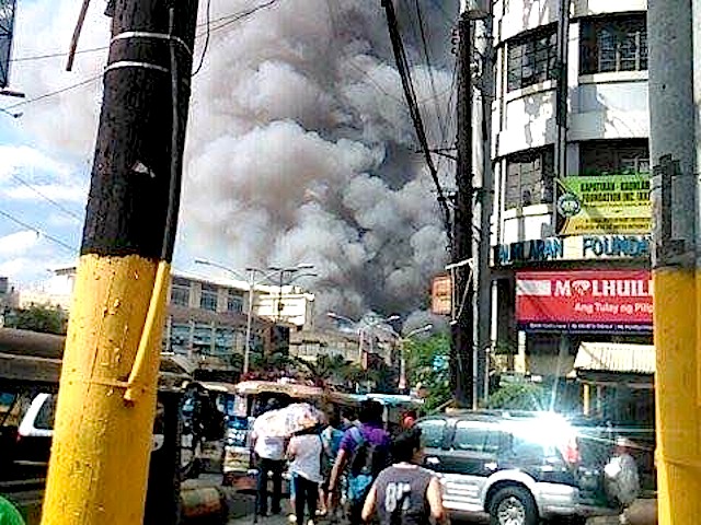 Fire Hits Residential Area In Manila Office Building In Quezon City
