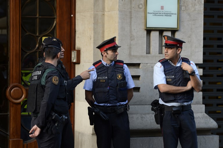 Spain police search Catalan gov't headquarters amid referendum row