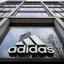 Adidas trips into quarterly loss but sees rebound